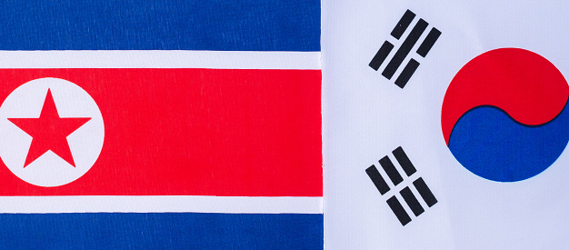 Korea against North Kores flags. Sanctions, war, conflict, Politics and relationship concept