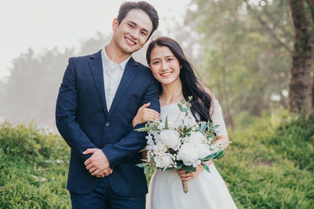 istock Image of young Asian bride and groom 1390990486