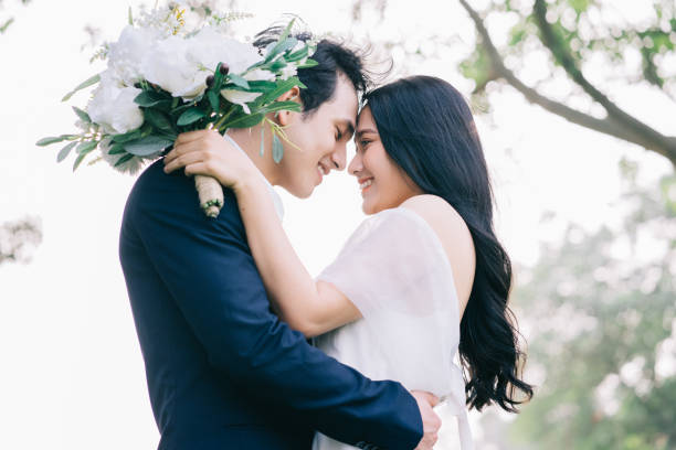 istock Image of young Asian bride and groom 1390990495