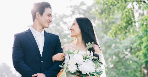 istock Image of young Asian bride and groom 1390990508