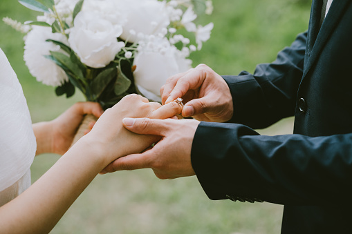 Image of young Asian bride and groom