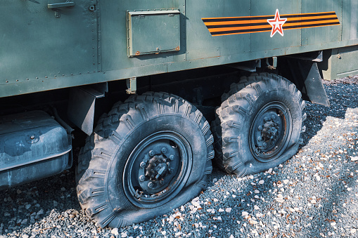 Flat tires of a Russian military vehicle close-up