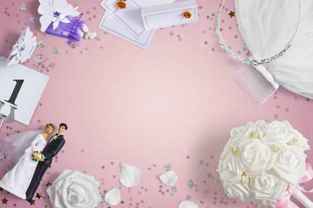istock Wedding accessories on a pink background with copy space 1390991008