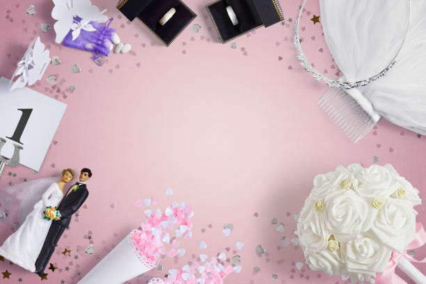 istock Wedding accessories on a pink background with copy space 1390991535