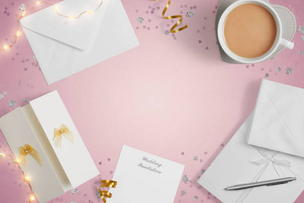 istock Blank Weddings invitations on a pink background with copy space 1390991766