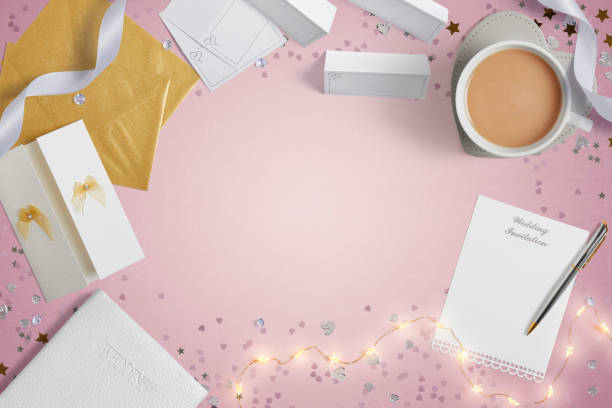 istock Blank Weddings invitations on a pink background with copy space 1390991791