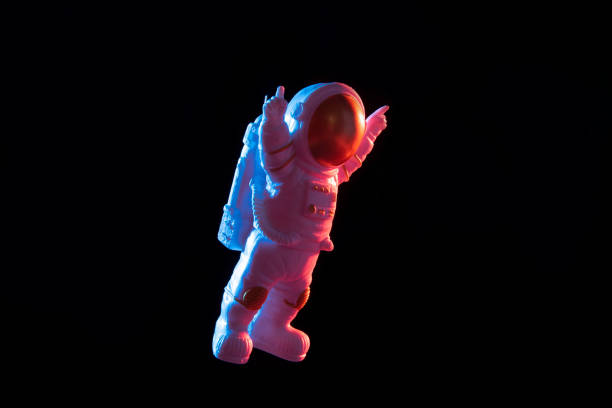 istock colorful spaceman spacewalk in space. 1390991888