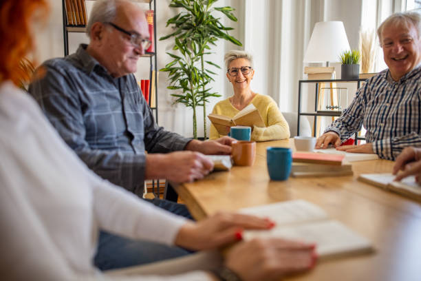 istock Senior people discuss the reference book, during book club meeting 1390991905