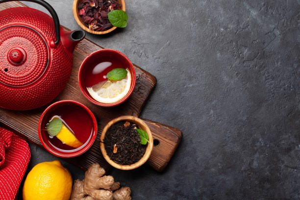istock Tea with lemon and mint and teapot 1390993160