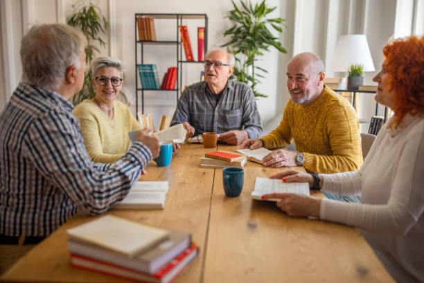 istock During book club meeting, senior people discuss the reference book 1390993615