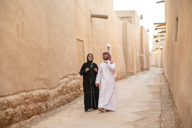 istock Smiling Saudi couple enjoying walk through open air museum 1390994403