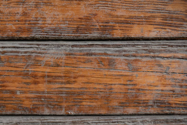 istock Brown wood texture background coming from natural tree. The wooden panel has a beautiful dark pattern, hardwood floor texture 1390994850