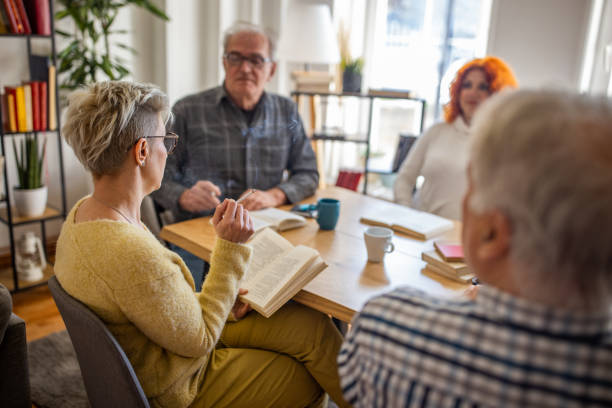 istock Caucasian people discuss the reference book, during book reading meeting 1390995666