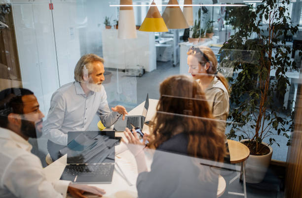 istock Business People Having a Meeting 1390996138