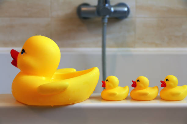 istock Mother duck and three little ducklings 1390996305