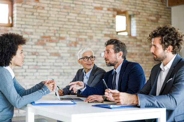 istock Human resource team talking to a candidate on a job interview. 1390996840
