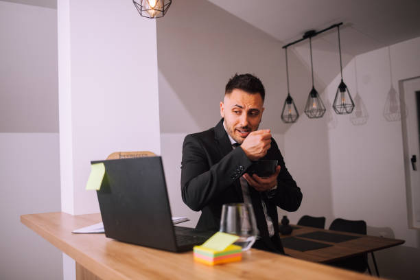 istock Overworked businessman at home 1390998074