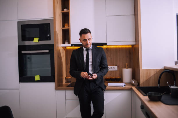 istock Overworked businessman at home 1390998075