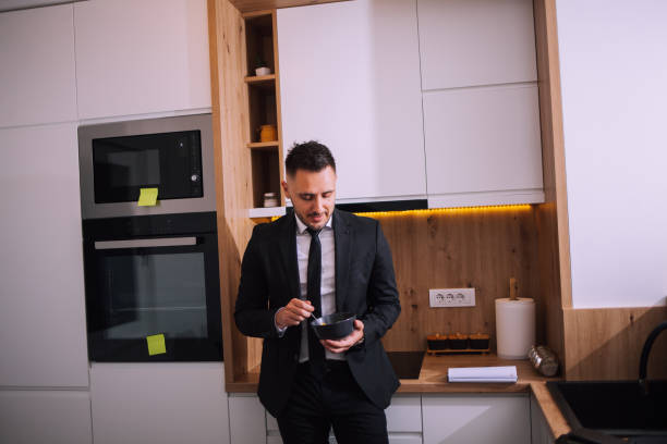istock Overworked businessman at home 1390999521