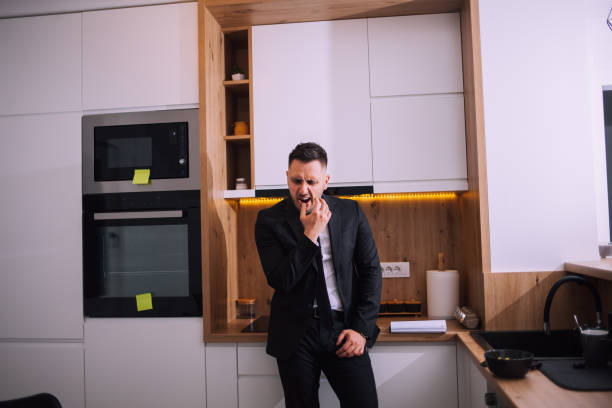 istock Overworked businessman at home 1390999544