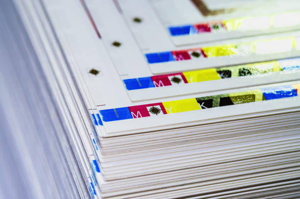 Sheets of printed products. Offset printing. CMYK press. Paper at the printing house. stock photo