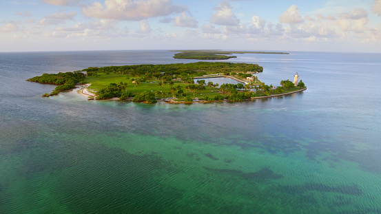 Aerial view of Boca Chita Lighthouse on Boca Chita Key during sunrise, Miami, Florida, USA.