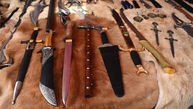 Medieval knives and swords in a store