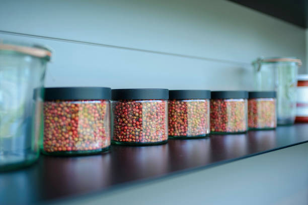 istock glass jars filled with pepper on a black glass shelf 1391005684