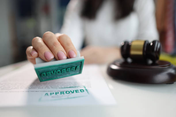 Judge puts approved seal on document in court closeup Judge puts approved seal on document in court. Judgment and lawyer services concept received stamp stock pictures, royalty-free photos & images