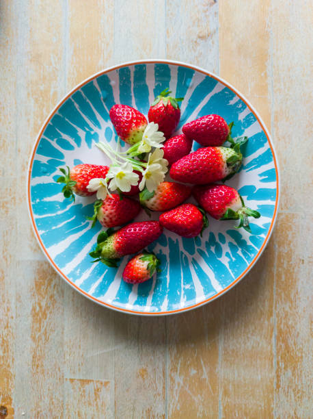 Fresh Red Ripe Strawberries in Plate on Wooden Table in Spring