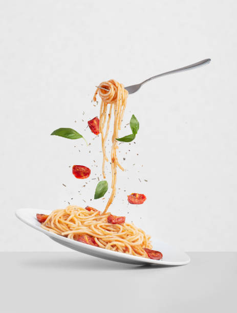 istock pasta with tomatoes and basil on a gray background 1391018475