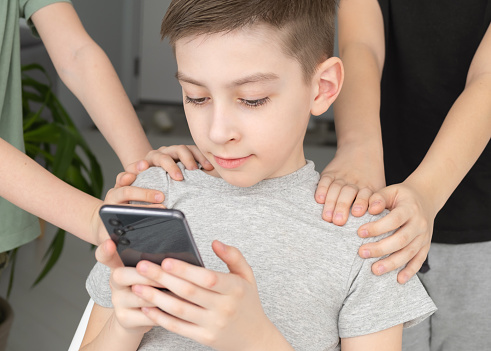 social concept boy in the phone hands around him.