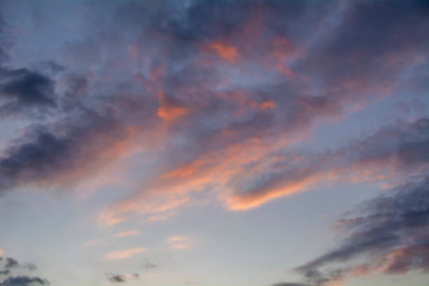 istock Clouds in the sky lit by the setting sun. 1391021766