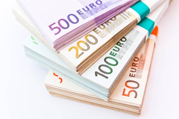 Fanned bundles of euro banknotes stock photo