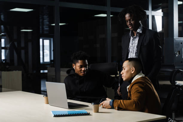 istock Multinational brainstorm group of colleagues working online on project in briefing room. Black african business man and asian work in team together. 1391023153