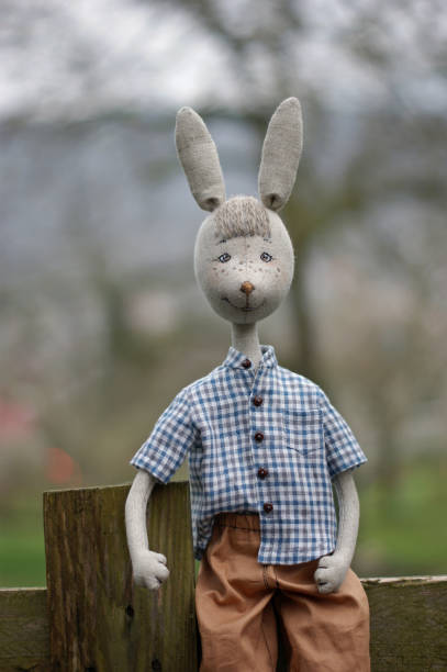 istock Portrait of a doll rabbit boy in a rustic style. 1391024247