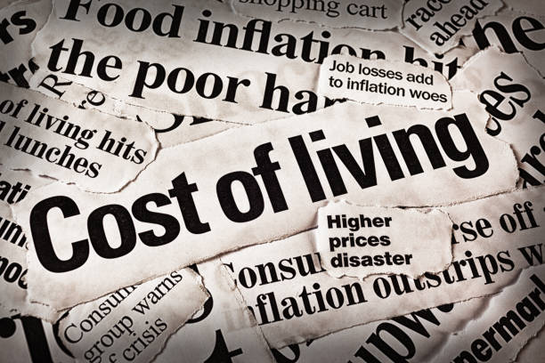 Inflation hits consumers: newspaper headlines about rising prices stock photo