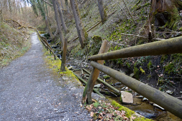istock Broken wooden railing on the side of a pathway 1391027036