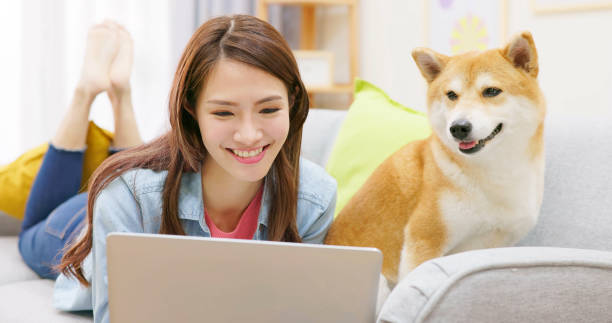 istock girl and dog on sofa 1391027288