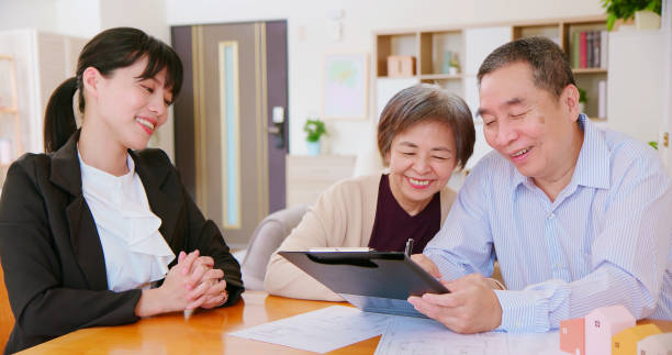 istock asian elderly couple buy house 1391029961