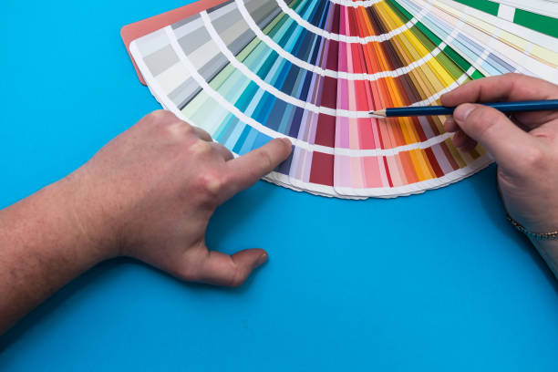 istock male hand choosing paint tone at color sampler isolated 1391030089