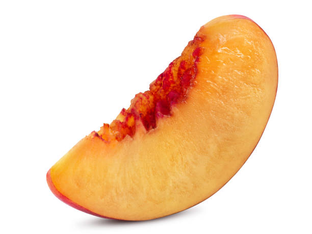 istock Unpitted, smooth-skinned nectarine fruit slice isolated on white background with copy space for text or images. Close-up shot 1391031881