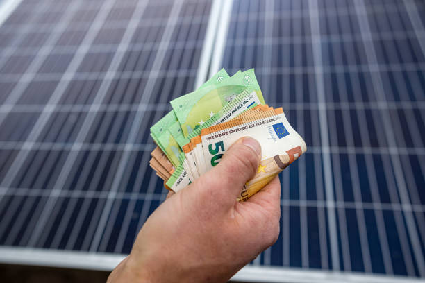 istock strong male hands of a worker holding euro banknotes for work done. 1391031943