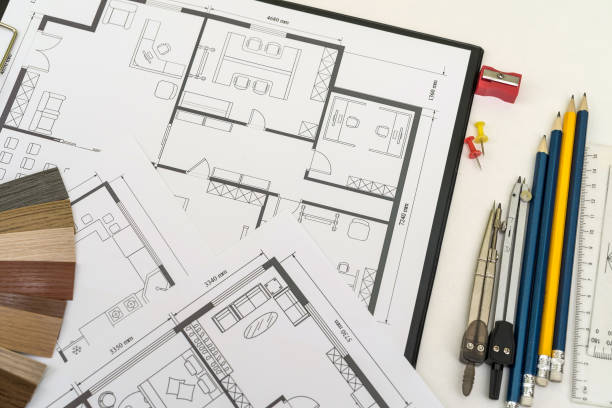 istock working at office desk with house blueprints for new project and color sampler drawing instruments 1391031958
