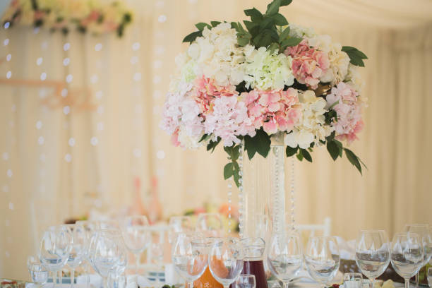 istock Vases with flowers on the wedding table 1391031992