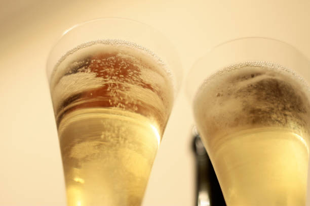 istock Bottle of champagne and a pair glasses 1391032644