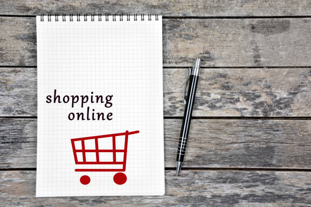 istock Shopping online words on notebook page 1391038415