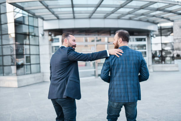 3D robotic render with business icon on three business men in happy moment.Modern businesses are using AI to help plan marketing and design products for success.