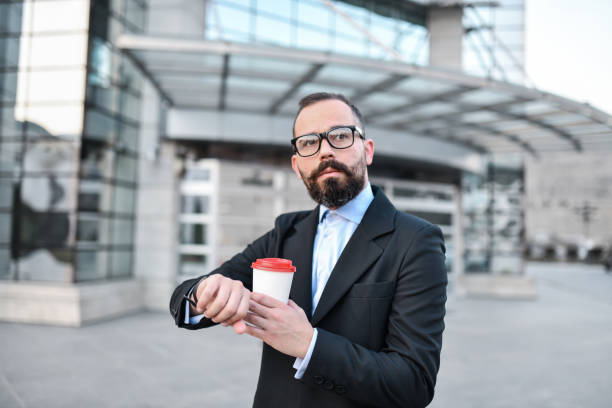 istock Businessman Looking How Much Time Left He Has For Coffee Break 1391043138