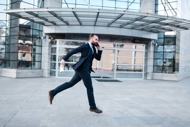 istock Modern Businessman Running Late To Work 1391043730
